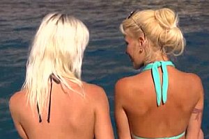 Hot blonde lesbian babes on a boat.